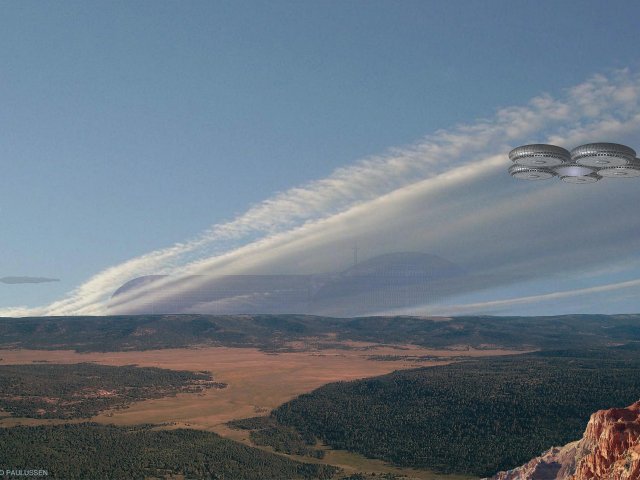 Die Montana von einem mittlerweile bewaldeten Nebenarm des Buvinda Vallis gesehen. Das Habitat wird von einem Wolkenband verhüllt.