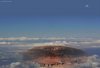 Der Olympus Mons schält sich aus der dichten Wolkendecke, die den Mars während der letzten Phase seiner Terraformung für Monate umschloss.
