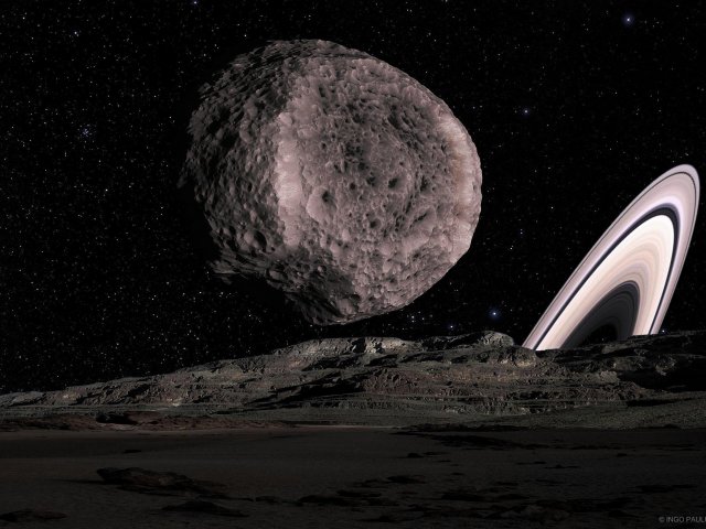 Begegnung zwischen dem Saturnmond Hyperion und einem großen Asteroiden, der das Saturnsystem durchquert.