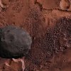 Der Marsmond Phobos ist auf 50 km herangerückt. Er schwebt hier mit 5900 km Bodenabstand über dem Chaosbereich der Valles Marineris.